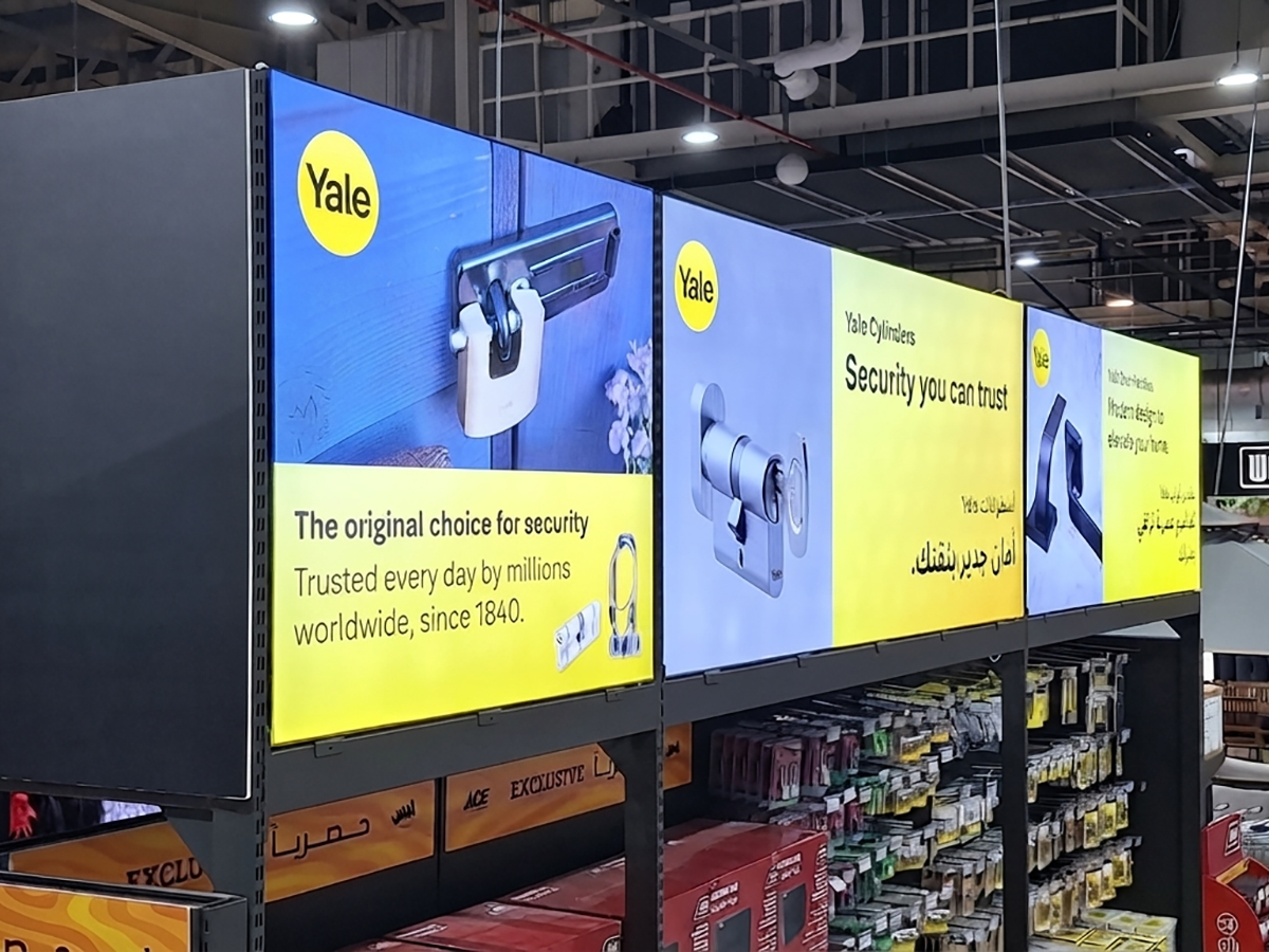 Organized Yale hardware store display with illuminated signage